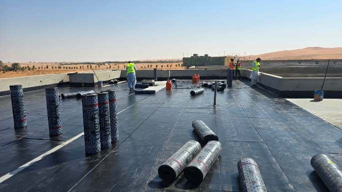 Bituminous membrane rolls laid on a roof, Al Qassab